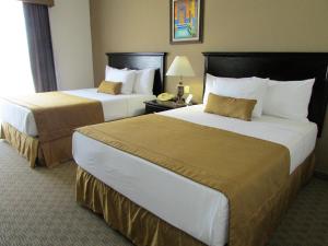 Säng eller sängar i ett rum på Best Western Hotel Posada Del Rio Express