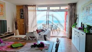 a living room with a view of the ocean at My Ocean View in Playa de San Juan