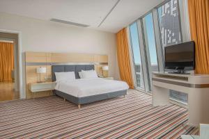Rúm í herbergi á Radisson Blu Hotel Batumi