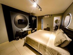 Postel nebo postele na pokoji v ubytování Castro's Hotel
