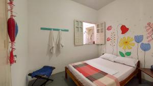 Hostel Casa Grande tesisinde bir odada yatak veya yataklar