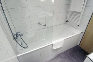 
a bathroom with a shower, sink, and toilet at Holiday Inn Prague Airport, an IHG Hotel in Prague
