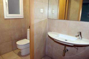 a bathroom with a sink and a toilet at Hotel Goya in Lleida
