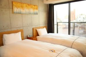 Uma cama ou camas num quarto em Yoshitsuki kaku - Yoshitsuki Apart Hotel