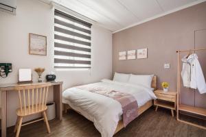 Voodi või voodid majutusasutuse Hibnb Guesthouse toas