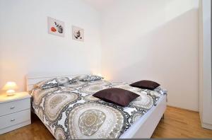 Postel nebo postele na pokoji v ubytování Apartments Nautilus