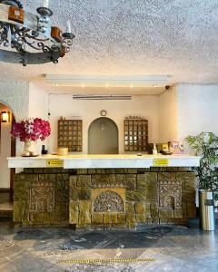 a stone counter in a building with flowers on it at Karteros Hotel in Karteros