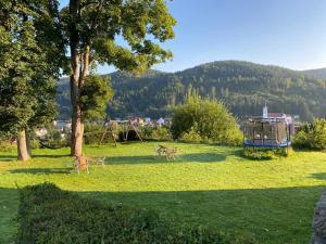 three deer running in a park with a playground at Chalupa u Josefa in Josefuv dul