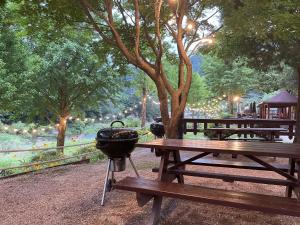 a grill sitting on a picnic table in a park at Kensington Resort Gapyeong in Gapyeong +40 photos
