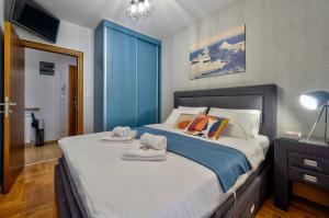 Tempat tidur dalam kamar di Apartment ERAK HILL