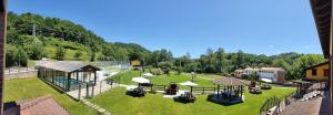 an aerial view of a park with a field of grass at Apartamentos El Castañeu in Corao