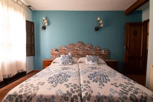 מיטה או מיטות בחדר ב-Ciudad de Verdeoliva