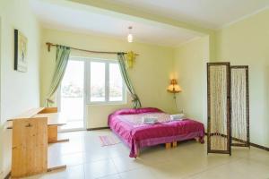 Postel nebo postele na pokoji v ubytování Yoga & Apartment Zlata Oliva
