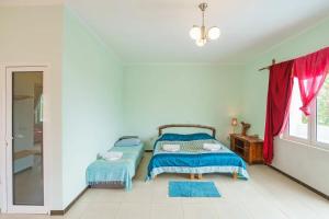 Postel nebo postele na pokoji v ubytování Yoga & Apartment Zlata Oliva