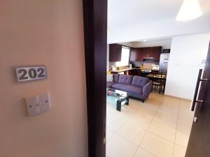 Posezení v ubytování Promenade Breeze City Apartment + 4 fotografie