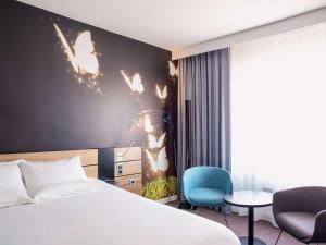 Posteľ alebo postele v izbe v ubytovaní Novotel Katowice Centrum