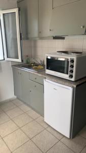 A kitchen or kitchenette at Sindonia beach Apartment's Még 30 kép