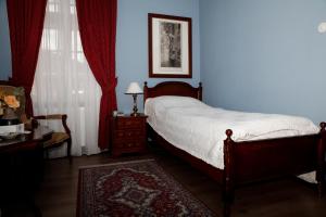 Postel nebo postele na pokoji v ubytování Hotel Zámek Štiřín