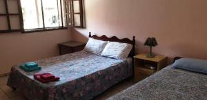 Un pat sau paturi într-o cameră la Fazenda São Felipe