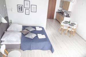 Posteľ alebo postele v izbe v ubytovaní Al-Dom Apartament 112 Awangardia, 300 m do plaży w dzielnicy uzdrowiskowej