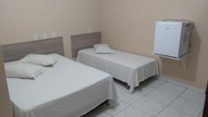 Katil atau katil-katil dalam bilik di Porto Seguro Hotel - Porto Velho