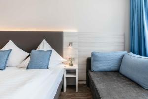 Postel nebo postele na pokoji v ubytování Westend Hotel (non-smoking)