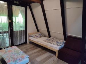 Posteľ alebo postele v izbe v ubytovaní Mátrai Vándor Apartmanok