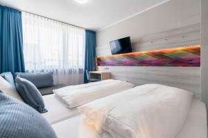 Postel nebo postele na pokoji v ubytování Westend Hotel (non-smoking)
