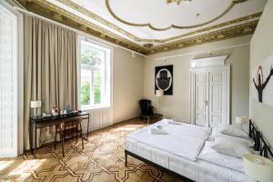 Posteľ alebo postele v izbe v ubytovaní Home Aparthotel