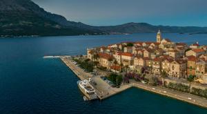 an aerial view of a town on the water at Aminess Younique Korcula Heritage Hotel in Korčula
