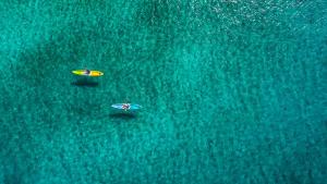 an overhead view of two surfboards in the water at Aminess Younique Korcula Heritage Hotel in Korčula