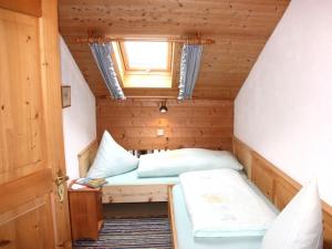 Un pat sau paturi într-o cameră la Jaklhof