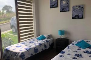 Postel nebo postele na pokoji v ubytování Casa de Playa Koumpí Beach + 31 fotografií