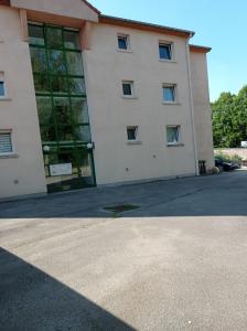 a large white building with a large window at Chambre chez l'habitant in Saint Die