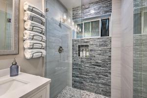 a bathroom with a shower and a sink at Airy Alpine Getaway with Lake Arrowhead Views! in Lake Arrowhead +27 photos