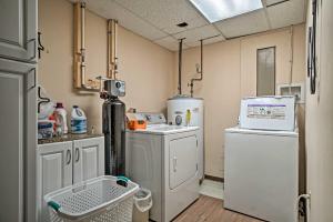 a laundry room with a washer and dryer at Mountain Retreat with Decks, Hot Tub, and Games! in Sky Valley +23 photos