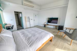 TV a/nebo společenská místnost v ubytování Sea House Diary Homestay