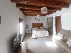 Postel nebo postele na pokoji v ubytování PEÑAFIEL DREAMS con JACUZZI