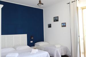 Postel nebo postele na pokoji v ubytování Ai Quattro Venti Guest House