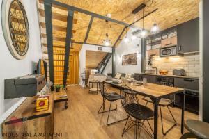 a kitchen and dining room with a table and chairs at 7 Styles Apartments by Raspberry Cascade in Faro