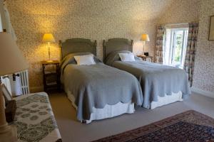 Ένα ή περισσότερα κρεβάτια σε δωμάτιο στο Gutchpool Farm