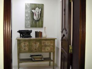 a room with a dresser and a picture on the wall at Antik Malta in Sliema