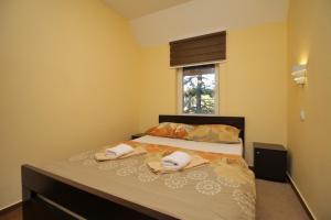 Voodi või voodid majutusasutuse Apartmani Milekic toas