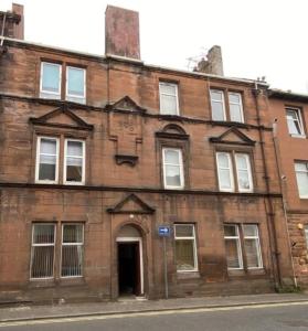 an old brick building on the side of a street at Quarry street Hamilton in Hamilton