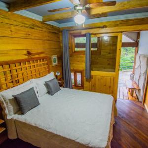 Postel nebo postele na pokoji v ubytování Hotel Hacienda Don Paolo