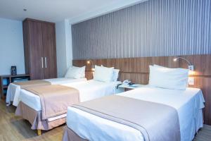 
Cama ou camas em um quarto em Casa Nova Hotel
