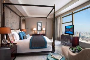 Postel nebo postele na pokoji v ubytování Tangla Hotel Tianjin