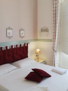 Säng eller sängar i ett rum på Il Giardino Del Purgatorio