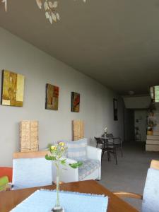 a living room with a couch and a table at Sea View Family Hotel in Kranevo