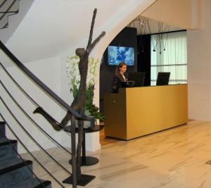 a woman sitting at a desk in an office at L'Amirauté Brest in Brest